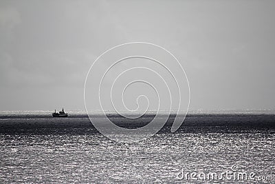 Boat on the silver sea Stock Photo