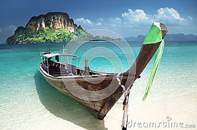 Boat on small island in Thailand Stock Photo