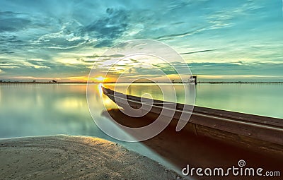 The boat speeding toward the sun Stock Photo