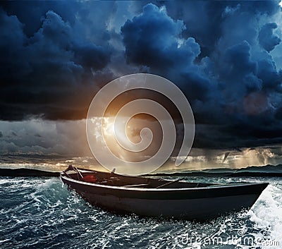 Boat in stormy sea Stock Photo