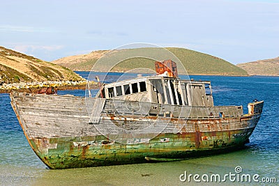 Boat stranded on the beach Stock Photo