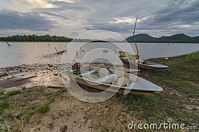 A boat stranded near the lake Stock Photo