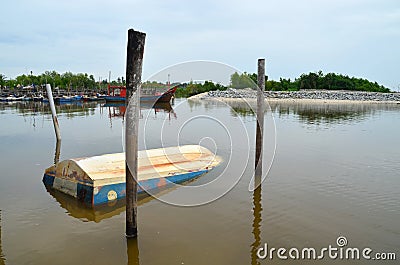 A boat that sunk at the fisherman`s jetty Editorial Stock Photo