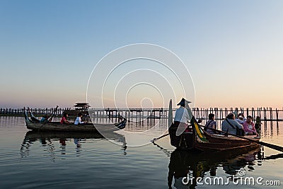 Boat in Taungthaman lake is watching Sunset at U Bein Bridge, A Editorial Stock Photo
