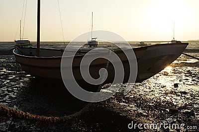 Boat Tethered When Tide is Out Stock Photo