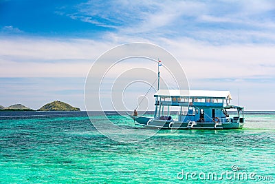 A Boat Tourist on Blue and Turquoise Clear Water Stock Photo