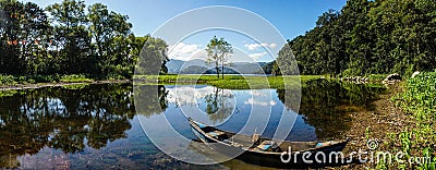 Boat on tranquil Lake Yojoa in Honduras. Stock Photo