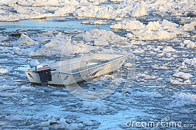 Boat trapped in ice on the Danube river in Zemun near Belgrade Editorial Stock Photo