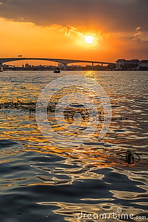 Boat view from Chao Praya river on Bangkok during beautiful sunset Stock Photo