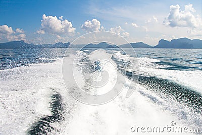 Boat wake prop wash on blue ocean sea Stock Photo