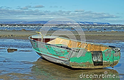 Boat Washed Ashore Stock Photo