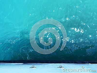 boat water ocean bow clear azure blue turquoise sea shiny sparkle aqua sunlight Stock Photo