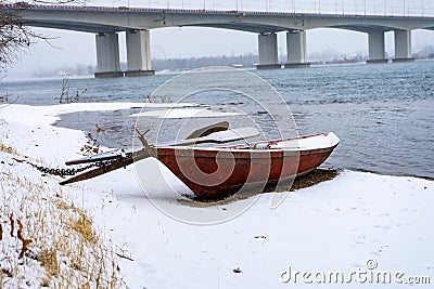 A boat on the winter coast. Stock Photo