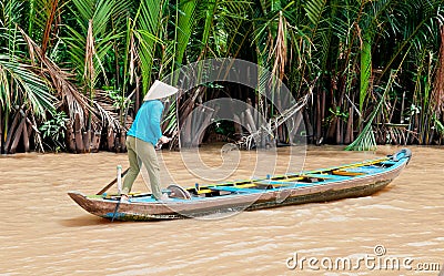 Boat Woman on the Mekong River Editorial Stock Photo
