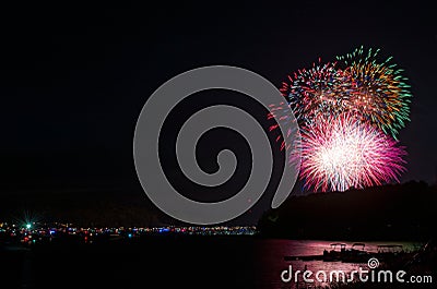 Fireworks over Lake Wallenpaupack in Hawley, PA for the 4th of July being watched by boaters Stock Photo