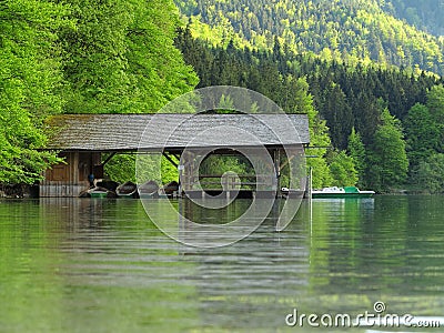Boat shed at mountain lake and forest, spring season nature Stock Photo