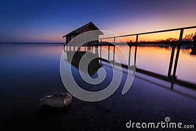 Boathouse in Stegen at the Ammersee at sunset in Bavaria Germany Stock Photo