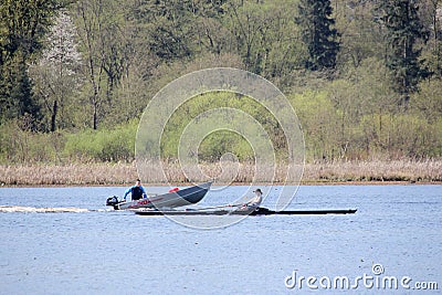 Coach and Woman Sculling in Burnaby Lake Editorial Stock Photo