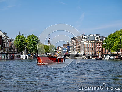 Boats along Amsterdam`s beautiful canals Editorial Stock Photo