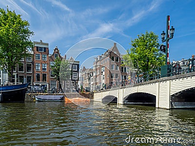 Boats along Amsterdam`s beautiful canals Editorial Stock Photo