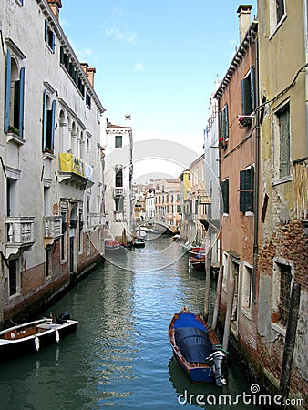 Boats along a canal in Venice, Italy Stock Photo