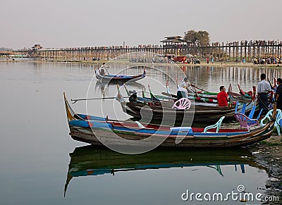 Boats on Amarapura lake at Ubein bridge Editorial Stock Photo