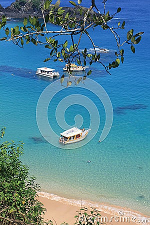 Boats anchored on clear waters Stock Photo
