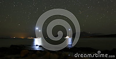 Boats anchored at night Stock Photo