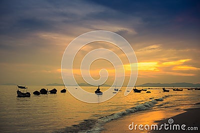 Boats anchoring in the sunset at Phala Beach Stock Photo