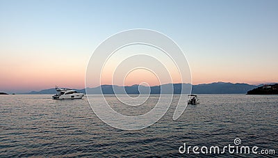 Boats in Bay at Dawn, Greece Stock Photo