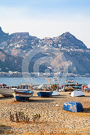 Boats on beach in old port in Giardini Naxos town Editorial Stock Photo