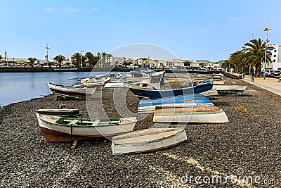 Boats beached in the outer lagoon of Charco de San Gines at low tide in Arrecife, Lanzarote Editorial Stock Photo