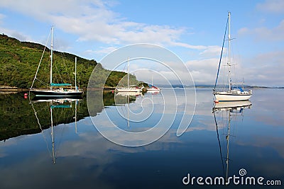 Boats berthing on a peaceful sea Stock Photo