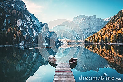 Boats on the Braies Lake Pragser Wildsee in Dolomites mountains, Sudtirol, Italy Stock Photo