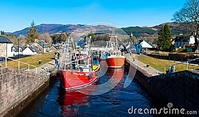 Boats in a Caledonian Canal Locks Editorial Stock Photo