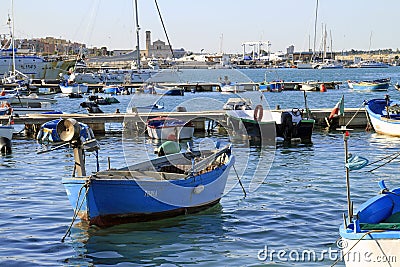 Boats in the calm sea in the port of Trani in Puglia, Italy Editorial Stock Photo