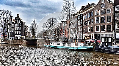 Boats in the canal in Amsterdam Editorial Stock Photo