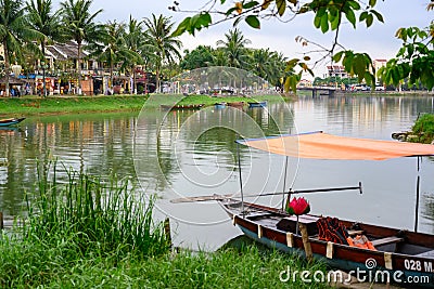 Boats on canal in tourist destination Hoi An, Vietnamese women in Hoi An, Vietnam Editorial Stock Photo