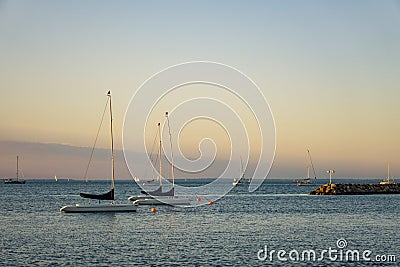 Boats close to a Danish harbour with a striking sunset Stock Photo