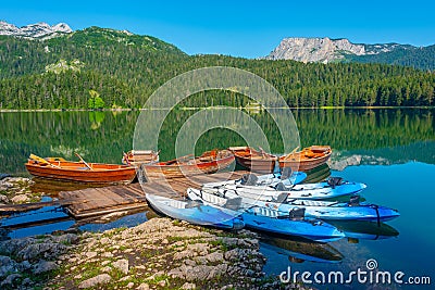 Boats at Crno Jezero aka Black lake at Durmitor national park in Editorial Stock Photo