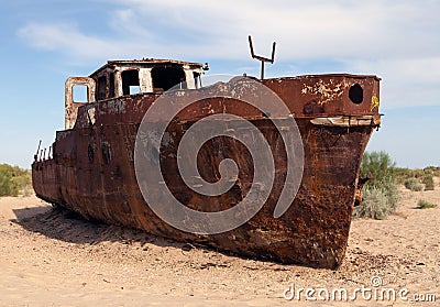Boats in desert around Moynaq - Aral sea Stock Photo