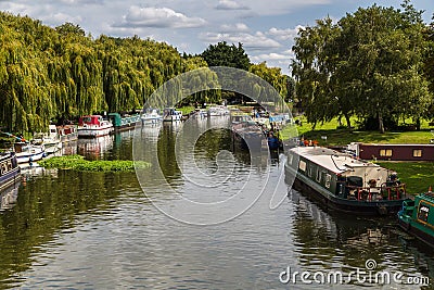 Boats line the river side of the River Great Ouse Stock Photo