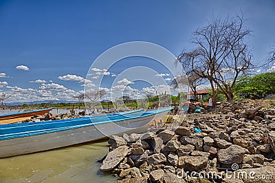 Boats docked on the shore of Lake Baringo Editorial Stock Photo