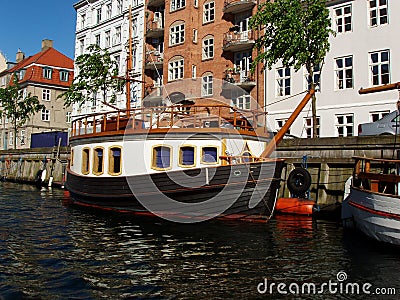 Boats and homes in Copenhagen Stock Photo