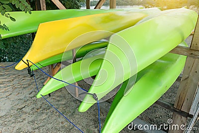 Boats kayak, canoe, kayaks. On the river bank, storage. Active rest in big city, on the river, Stock Photo
