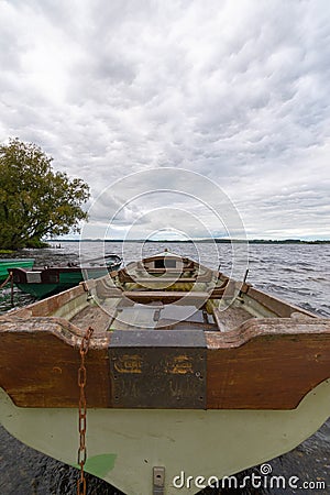 boats on the lake shore with low cloudy sky Stock Photo