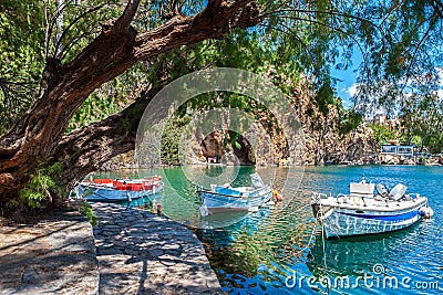 Boats on Lake Voulismeni. Agios Nikolaos, Crete Stock Photo