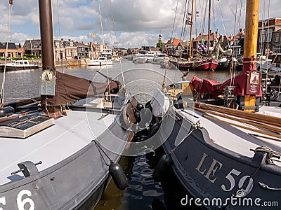 Boats in Lemmer Binnenhaven canal, Friesland, Netherlands Editorial Stock Photo