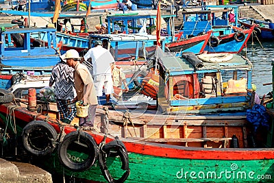 Boats and Lifestyle at Qui Nhon Fish Port, Vietnam in the morning. Editorial Stock Photo