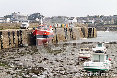 Boats at low tide in a harbour Editorial Stock Photo